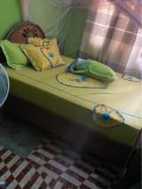A picture of Kitanda mbao ngumu 5 6 Bei 145000 Bila godoro 0788053103