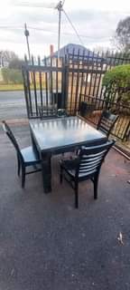 A picture of am selling a dining table with 4chairs is in every