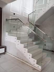 A picture of stainless steel frameless glass