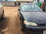 A picture of Corolla for sale the engine is tapping and no battery