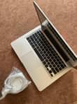 A picture of MacBook Pro. Core i7. Ram 8gb