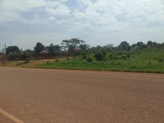 A picture of 100 by 100 ft that touches the tarmac road of