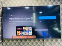 A picture of 75 inch Chiq Qled tv smart brand new with 3