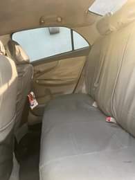A picture of GIVEAWAY DEAL TOYOTA COROLLA 2010 MILEAGE 72 000 NEWLY PAINTED