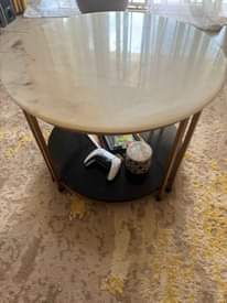 A picture of Original 6 seater leather chairs en round marble center table.on