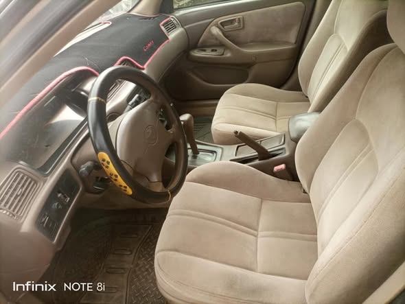 A picture of 1999 model Toyota Camry All documents intact with untempered engine