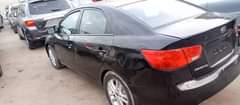 A picture of Kia Cerato 2012 with a bad gear Ac working Sound