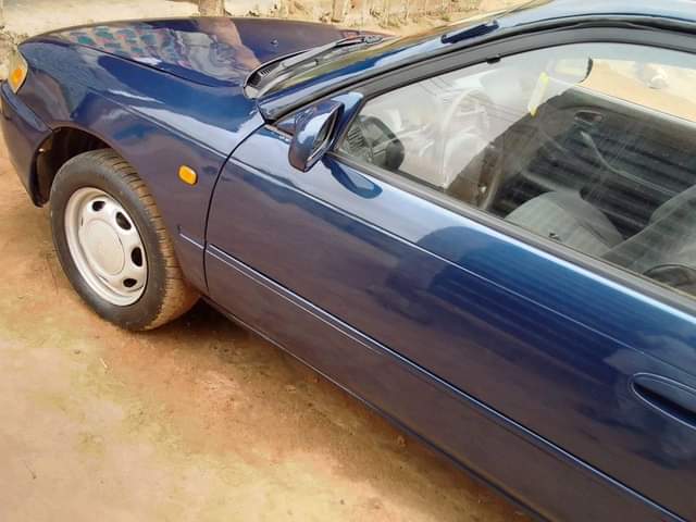 A picture of Toyota Corolla is available engine and gear is ok