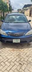 A picture of Acura txs 1 2 2007 and Toyota Camry 2 4