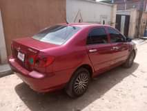 A picture of Sharp Toyota Corolla LE 2006 Red