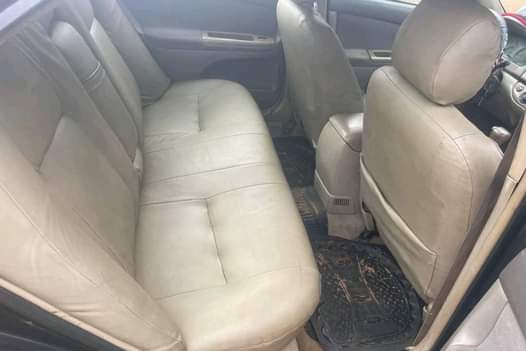 A picture of 04 Toyota Camry XLE 4 plug. Painted. Engine and gear