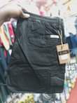 A picture of Kaki cargo pants Price ugx 65 000 Call Whatsapp me