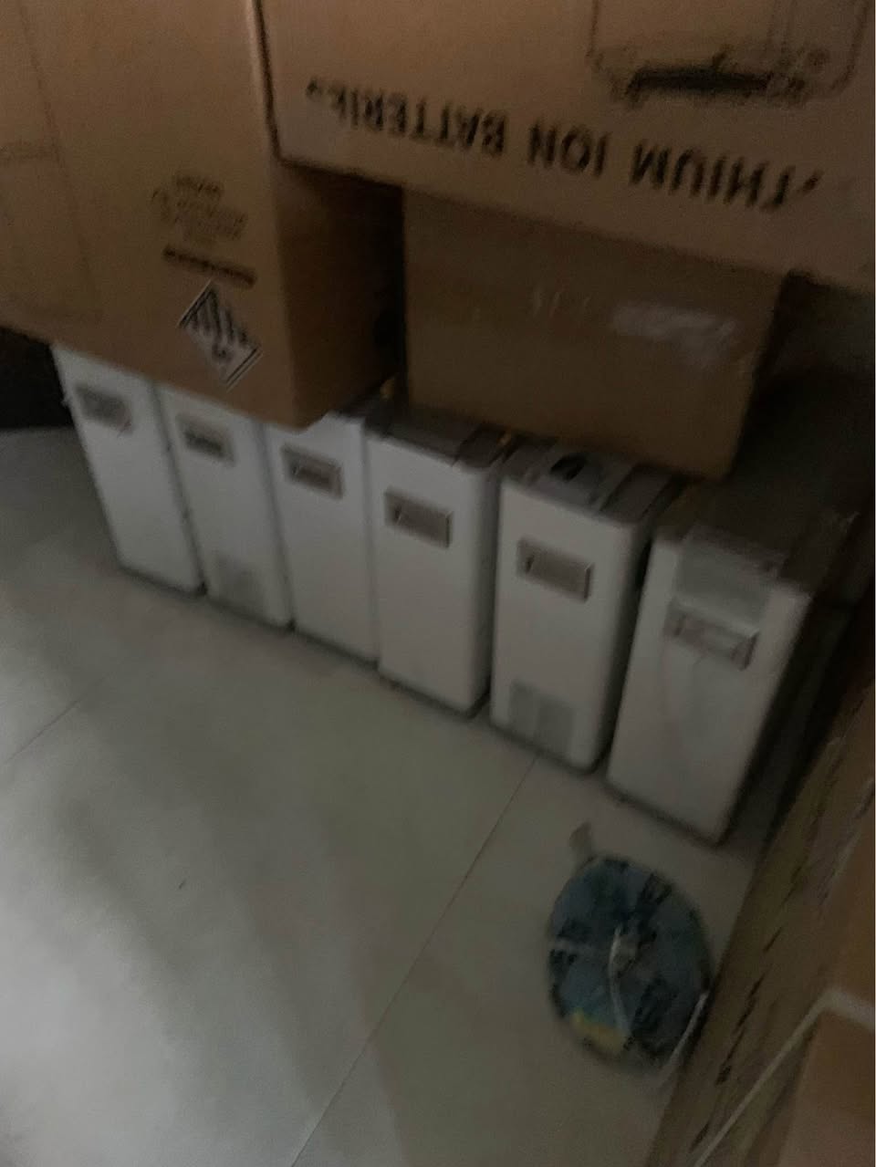 A picture of 10kwh lithium ion batteries with 12volt batteries