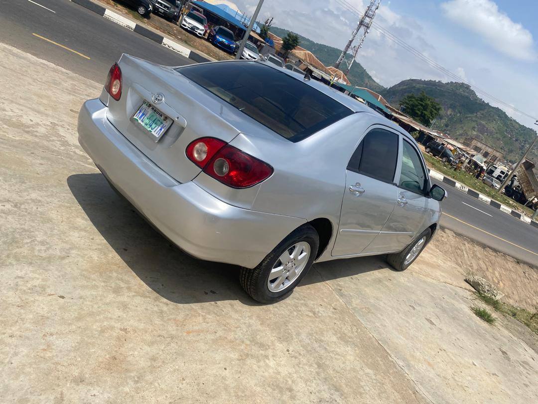 A picture of Newly painted 2006 Toyota Corolla with sound engine and gear