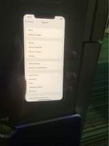 A picture of iPhone 11 Pro Max 256 with small covered crack at