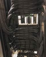 A picture of computer networking cabling and router installation