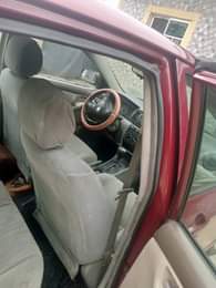 A picture of Toyota Corolla red with silent engine sharp gear and chilling