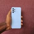 A picture of samsung A13 0655695769 64gb ram 4 BEI 230 000 Finger