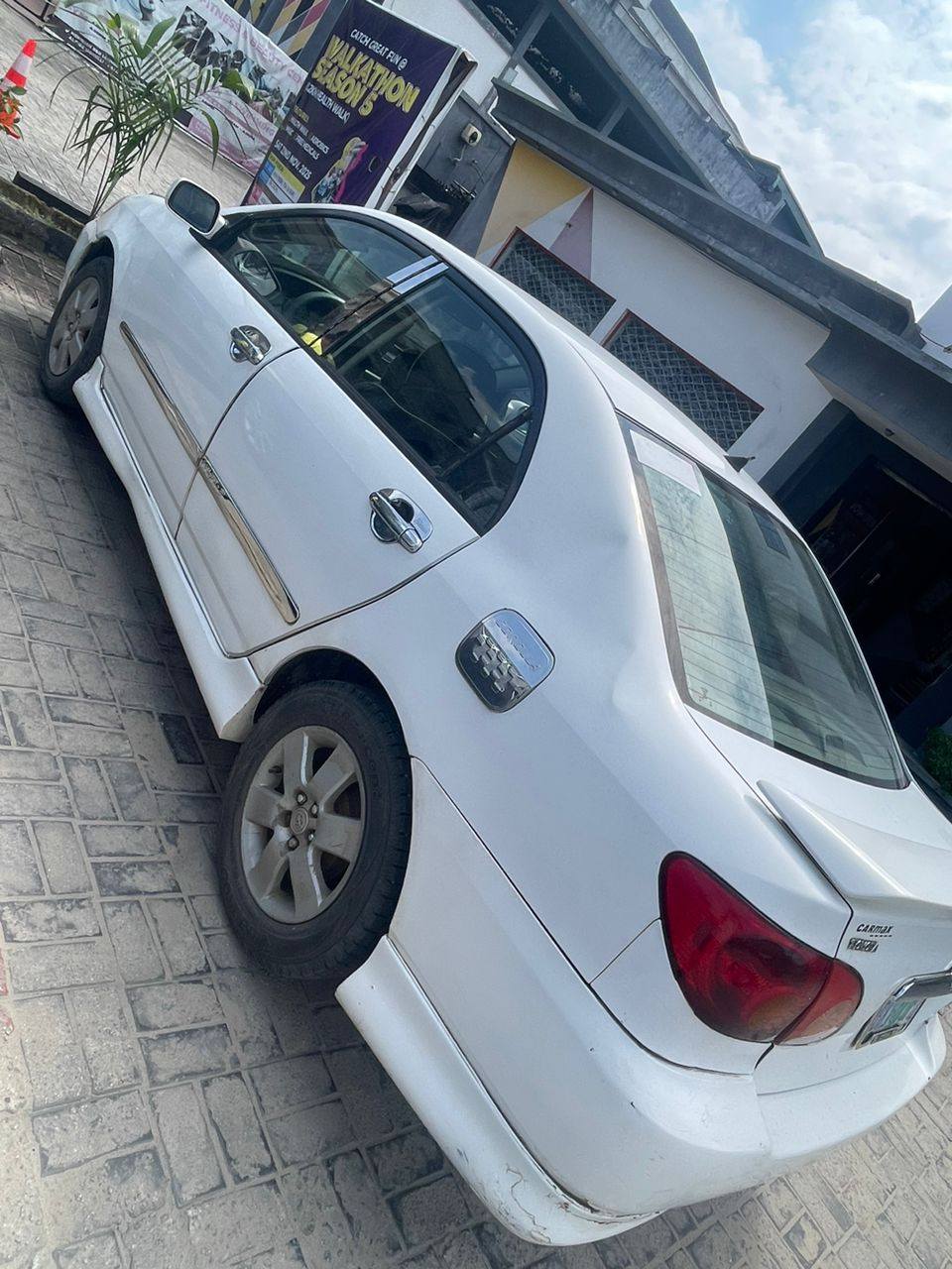A picture of Sharp 04 Toyota Corolla with untouched engine gear and AC