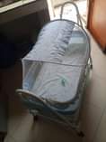 A picture of Baby bed with mattressand a mosquito net
