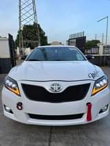 A picture of FOREIGN USED TOYOTA CAMRY 2011 Model Interior Clean 2023 headlight