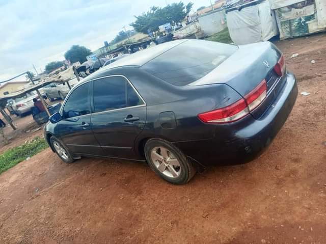 A picture of super clean 2004 model neatly painted Honda Accord with unterpered
