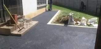 A picture of Tar surfacing and brick paving