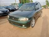 A picture of Clean Mazda 323 2004 model manual Tokunbo standard first body