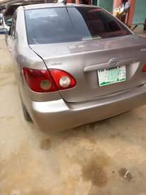 A picture of Toyota Corolla 2004 Gold very neat