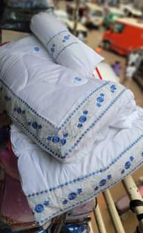 A picture of 13pc cotton duvets Package has Two bedsheets Four pillowcases Two