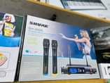 A picture of Microphone keyboards guitar and speakers 0708392737