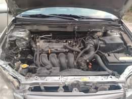 A picture of DEALER S Market Toyota Corolla 2004 Engine has little top