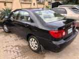 A picture of 2004 FEW MONTHS REGISTERED TOYOTA COROLLA LE FIRST PAN BODY