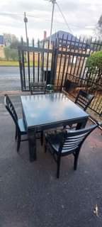 A picture of am selling a dining table with 4chairs is in every