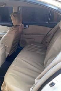 A picture of Clean Nigerian Used White Kia Optima 2009