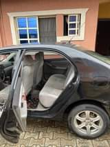 A picture of Belguim grade 2004 corola at owners hause owner wonna Japa
