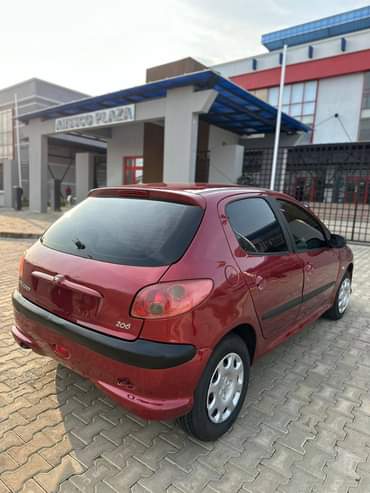 A picture of QUICK SALE EXTREMELY CLEAN USED 209 MANUAL TRANSMISSION 2003 MODEL