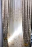A picture of Curtains and rod s