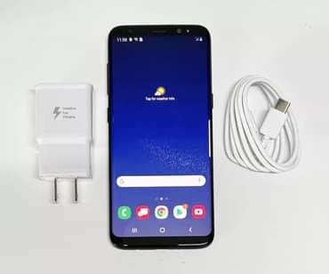A picture of Sumsung s8 phones available in stock with a charger as