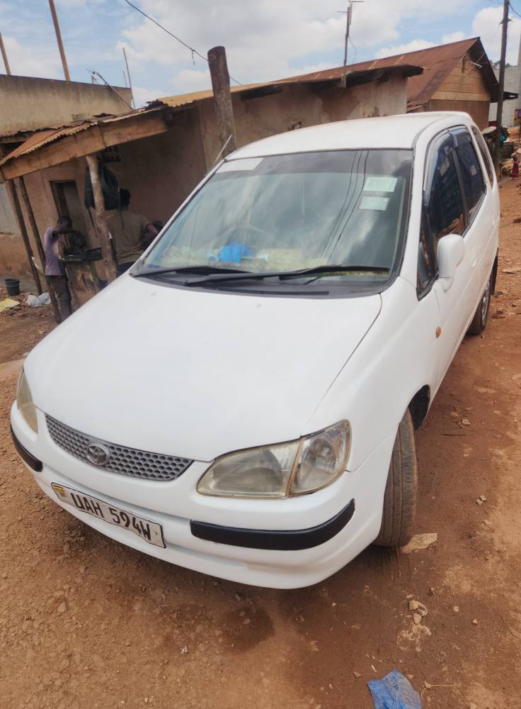 A picture of A White Toyota Corolla Spacio