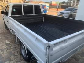 A picture of Nissan pickup full Ac manual transmission petrol new tires million