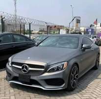 A picture of REGISTERED 2016 MERCEDES BENZ C300 COUPE Grey on Brown Interior