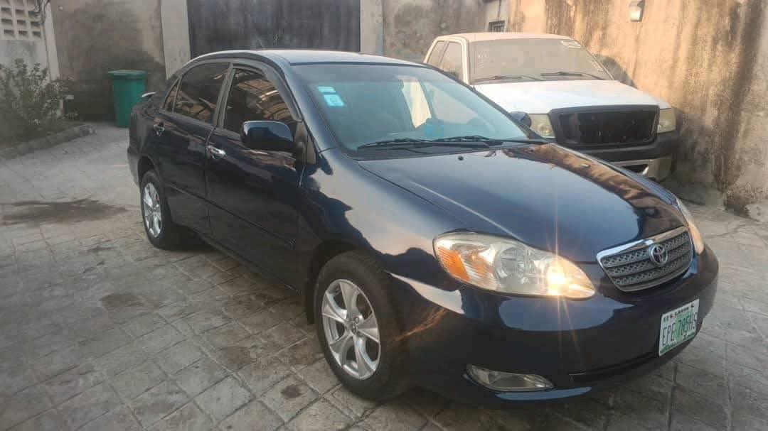 A picture of Toyota Corolla 2003. Painted. Engine gear and ac are working