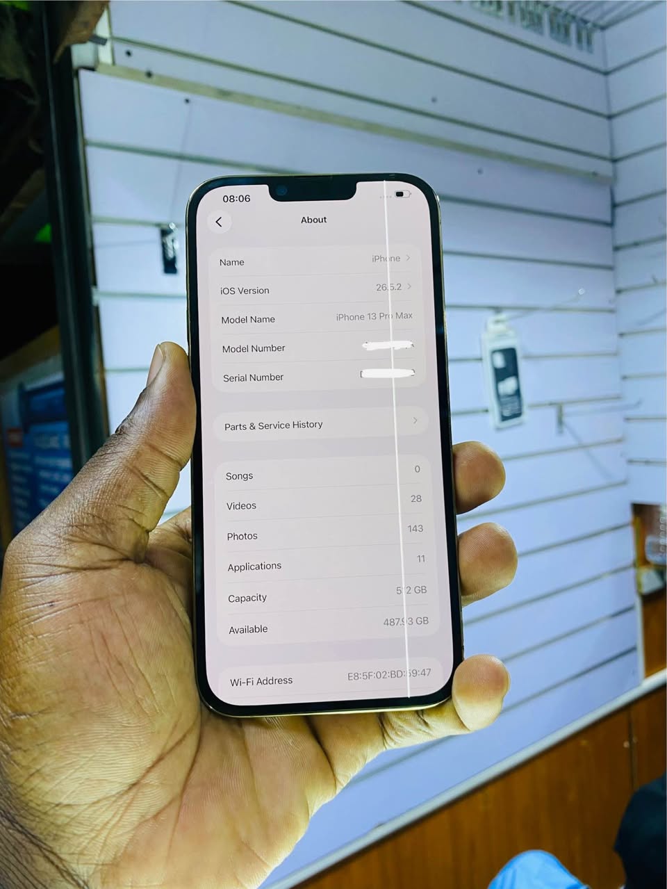 A picture of iPhone 13pro max with a line as seen 512gb no