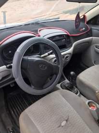A picture of Hyundai accent complete first body engine gear perfect. Ac not