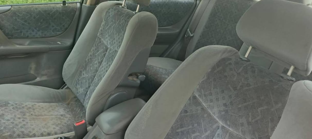 A picture of Mazda 323 money needed in 1 hour time engine and