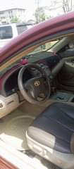 A picture of Toyota Camry 2010 model with chilling AC everything working Uyo
