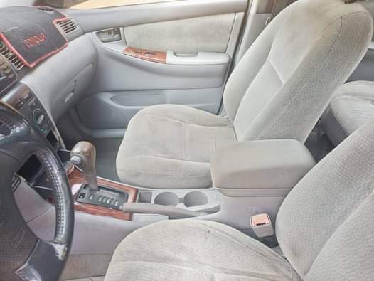 A picture of Toyota Corolla 2004 Color Black Neat interior Engine 100 fine