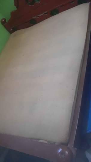A picture of kitanda na godoro lake 80k sofa la wawawili 70k .