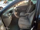 A picture of Good grade black Corolla Ac intact Gear intact Engine intact